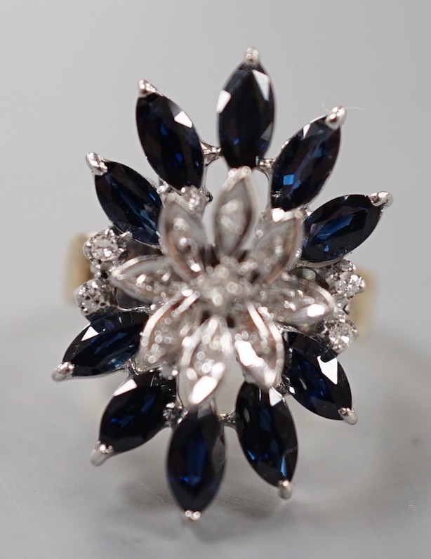 A modern 18k, sapphire and illusion set diamond chip set cluster dress ring, size K, gross weight 8.1 grams.